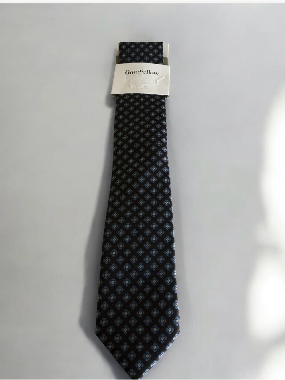Goodfellow & Co brown necktie with a blue square geometric pattern.